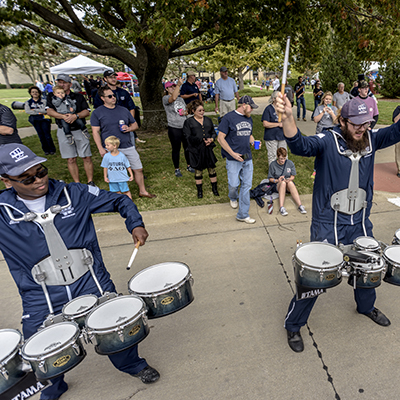 The drum line at Washburn always puts on a show while marching into the stadium for home football games.